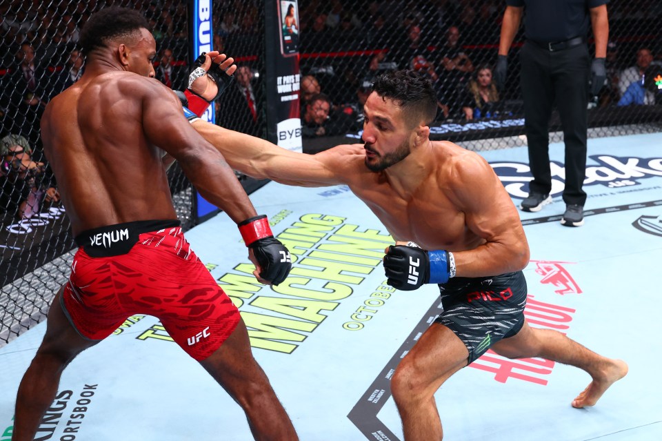 Aaron Pico punches Lerone Murphy in a UFC featherweight fight.