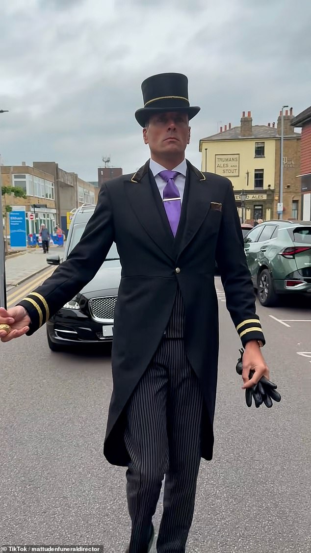 The funeral directors posted to TikTok showing an undertaker leading the hearse in what they call a 'centuries-old tradition'