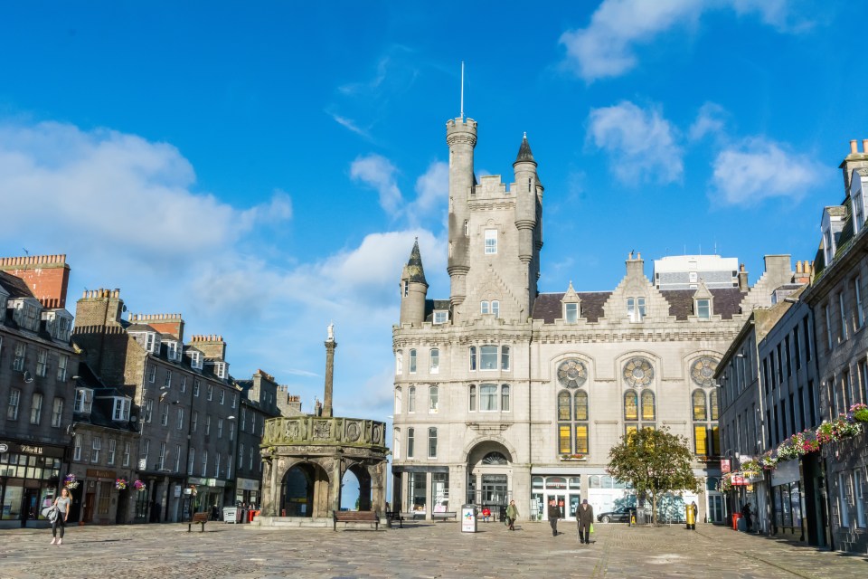 Castle Street in Aberdeen, Scotland, with the Salvation Army Citadel and Mercat Cross.