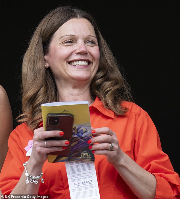 Lady Starmer was pictured enjoying the warm weather in a bright orange sundress as she attended The King George and Queen Elizabeth Stakes at Royal Ascot last night