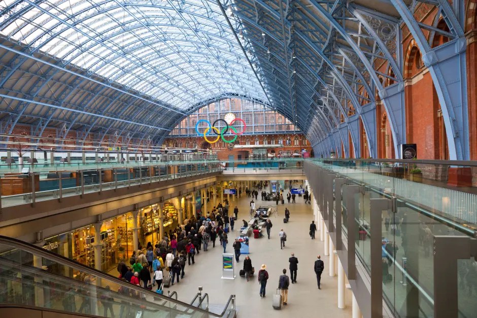 Interior view of London King's Cross station with the Olympic rings visible.