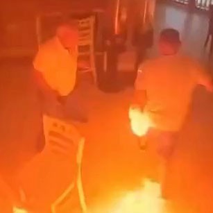 Story from Jam Press (Man Torches Cafe) Pictured: Video grab - CCTV captures the moment a man set fire to a caf¿ in Seville after being denied mayonnaise. VIDEO: Firebug torches caf¿ after 'being denied mayo' A man allegedly torched a caf¿ after being told they didn¿t have any mayonnaise. CCTV footage shows the suspect storming inside, dousing the counter with petrol, and sparking it with a lighter. As flames shot towards the ceiling, he calmly strolled back out ¿ slapping at his own arm, which had also caught fire. Terrified customers, including children as young as four and elderly diners, bolted for the exit as staff battled the blaze with an extinguisher. Owner Jos¿ Antonio Caballero said the man had first asked for ¿a couple of sachets of mayonnaise¿ for his sandwich. After being refused, he tried again with another waitress, and then headed to a nearby petrol station to buy a 1.5-litre bottle of fuel, as reported by NeedToKnow. Minutes later he returned, asked a third time, and when told no again, poured petrol over the counter and set it alight. ¿Three different waiters told him we didn¿t have mayonnaise, and that was it,¿ Caballero said in disbelief, adding that the man had shown no previous signs of trouble. The caf¿ ¿ Las Postas in Los Palacios y Villafranca, Seville province ¿ said in a statement: ¿Fortunately, none of us or our customers suffered any serious harm ¿ only material damage that can be replaced.¿ Caballero estimates the financial hit at ¿7,000 (¿6,055) to ¿9,000 (¿7,784). The suspect ¿ around 50 years old, from Priego de C¿rdoba, and said to have a criminal record ¿ was arrested minutes later in a nearby square. He was taken to a health centre under police guard for burns to his arm. ENDS EDITOR¿S NOTES: Quotations have been translated to English. We would advise publications to blur the suspect as well as bystanders visible in the CCTV prior to publication. Grabs from the video have been provided with pixelation for use. Video Usage Licence: (SOCIAL AND LOCAL MEDIA) We have obtained this material from a verified account on social media platforms and it has been widely used in local news media on a similar report without problems. Video Usage Restrictions: Jam Press accepts all responsibility for use on news media portals only, usage on social media platforms like Facebook and YouTube is not guaranteed.