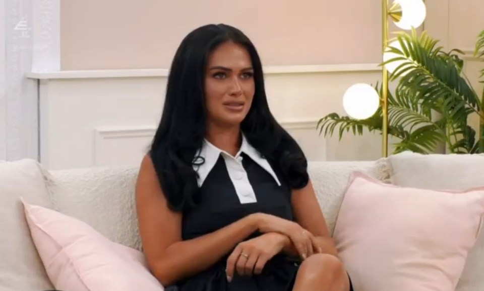Woman sitting on a couch.