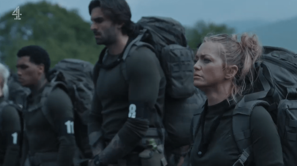 A woman and several men carrying large backpacks.