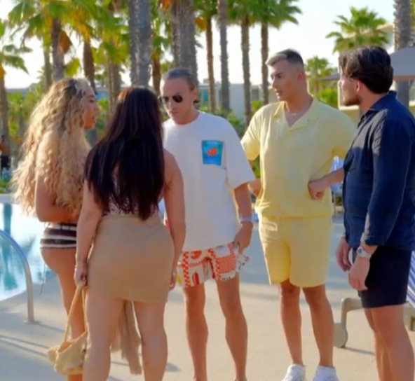 Screenshot of a group of people by a pool.