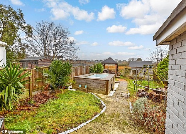 Wayne Couzens' marital home has gone on the market for £280,000 - complete with a hot tub he built in the back garden (pictured)