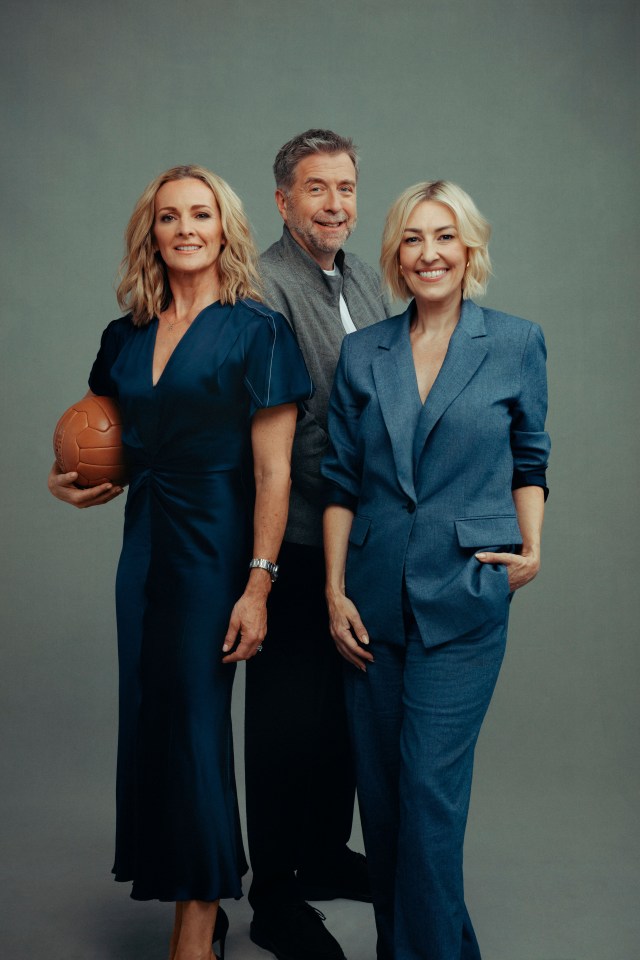 Three people posing for a photo, one holding a football.