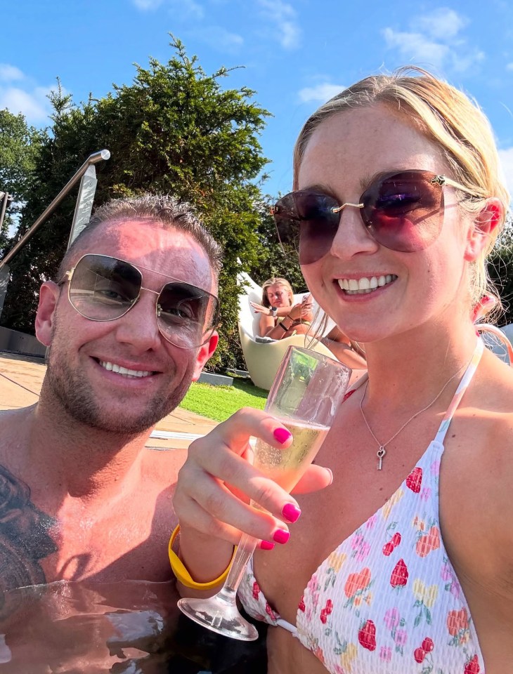 Couple celebrating anniversary in a hot tub.