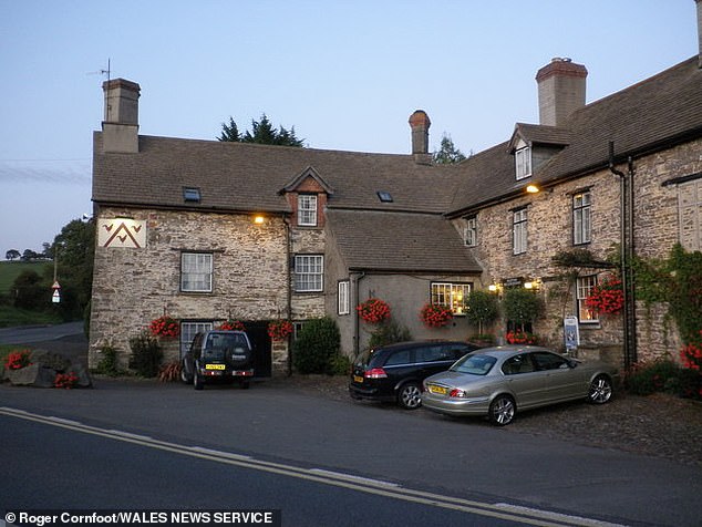 The Three Cocks Inn (with logo, top left of building), in the Welsh village of the same name
