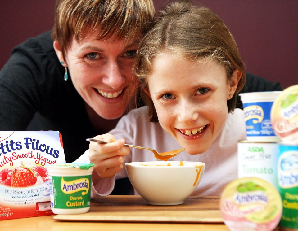 Photo of a mother and daughter eating together.
