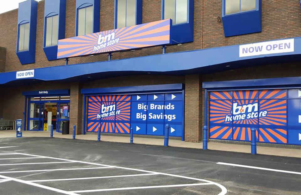 B&M Home Store exterior; "Now Open" sign.