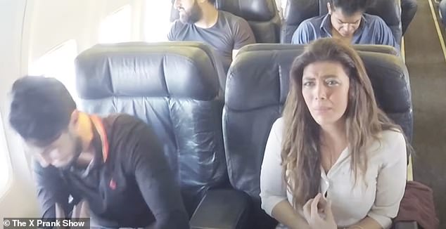 Media personality Reham Hajjaj (pictured, right) was seen getting on the plane, clueless as to what was going to happen to her