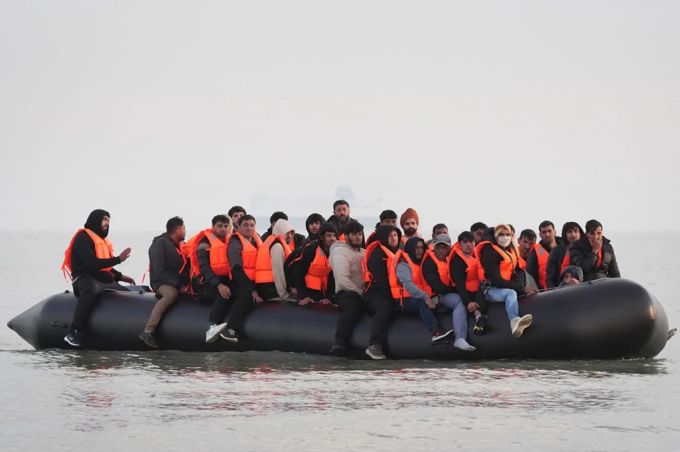Migrants in a small boat crossing the English Channel.