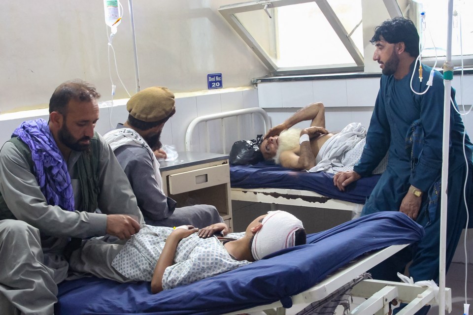 Injured Afghan people receiving treatment in a hospital.