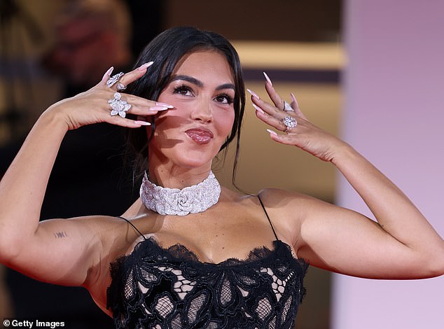 Last night, Georgina made sure to show off her huge 30-carat diamond sparkler, said to be worth £2.2 million, on her ring finger as she held her hands up while posing on the red carpet during the 82nd Venice Film Festival