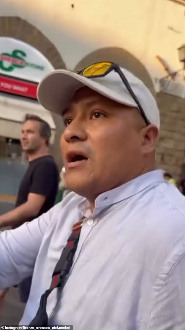 The footage shows another pickpocket appearing and trying to argue the woman should be released