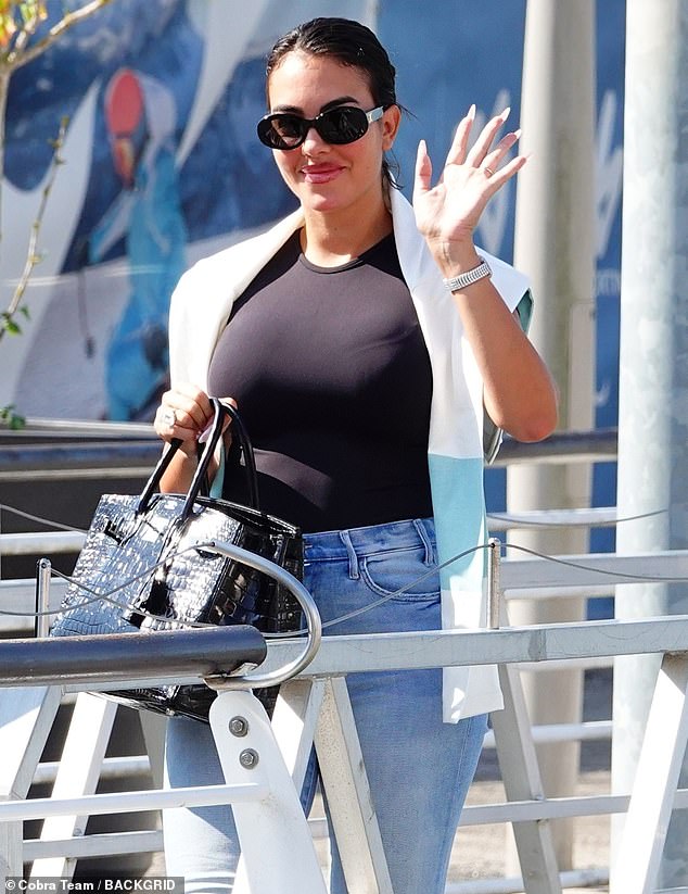 She was also showcasing her wealth with her incredible handbag