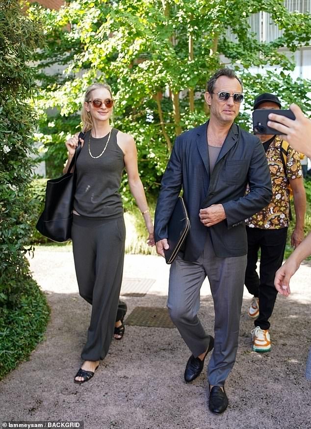 Jude Law, 52, and his beloved wife Phillippa Coan, 38, looked smitten holding hands as they were seeing arriving at Venice Airport on Monday amid the 82nd Film Festival