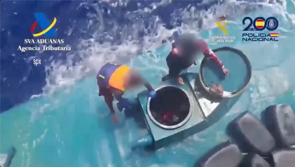 Spanish authorities arresting the crew of a narco-submarine.