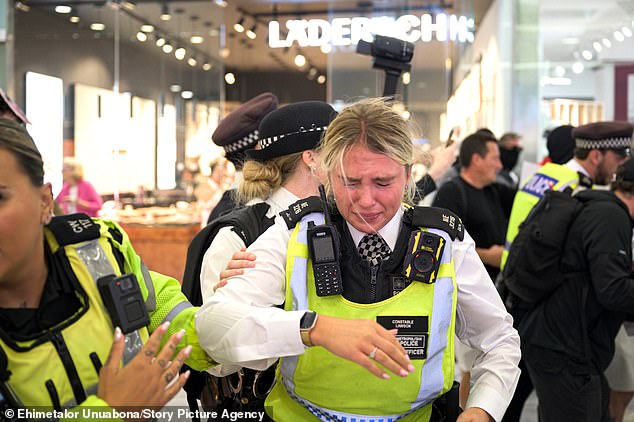 Far-right protesters clashed with members of the public and police officers inside Canary Wharf shopping centre