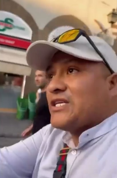 Man speaking to camera.