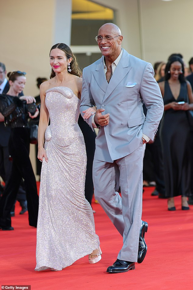 The pair linked arms as they made their way inside