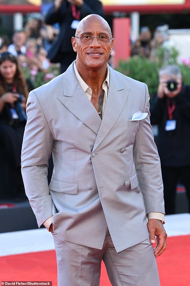 The Rock donned a pair of cool clear glasses as he posed for pictures