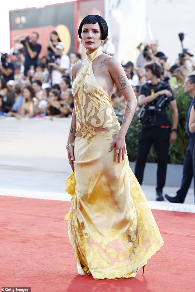 Halsey wowed in a daring yellow halterneck gown as she walked the red carpet
