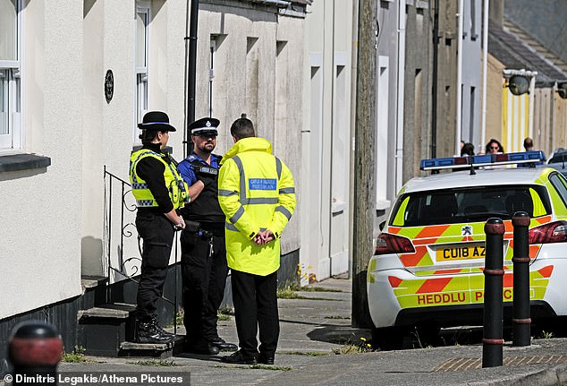 Mrs Fraser's whitewashed bungalow in the town guarded by police following the discovery of her body in May 2022