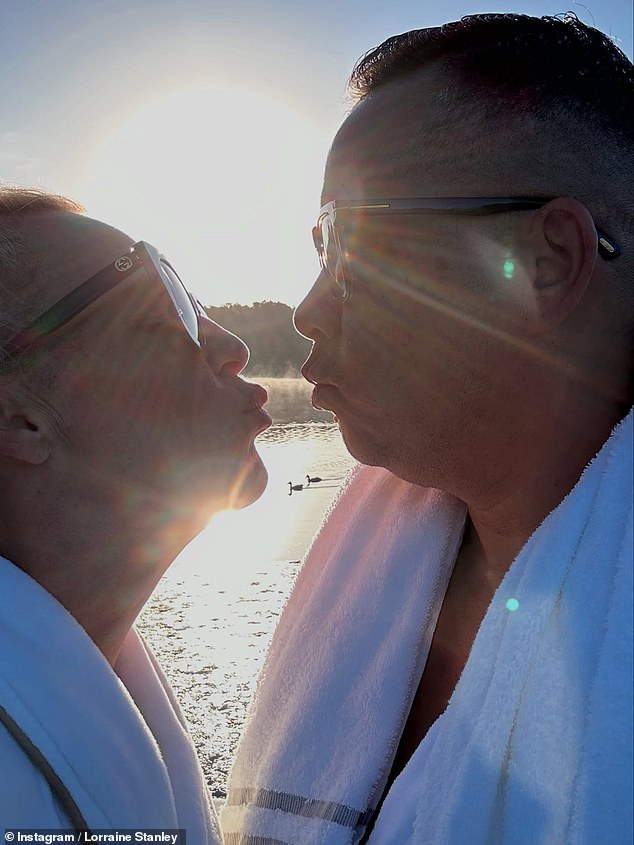 The couple looked as smitten as ever as they puckered up for a kiss and donned matched fluffy robes to tuck into a personalised chocolate dessert