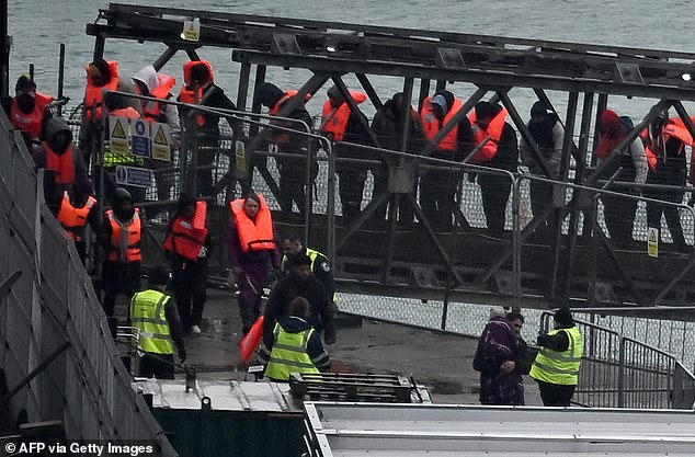 Some 3,567 people have landed in the UK in dinghies since the deal with France was ratified, with none returned thus far. Pictured: Migrants picked up at sea attempting to cross the English Channel from France disembark from Border Force vessel 'Typhoon' after it arrived into Dover on February 9, 2025