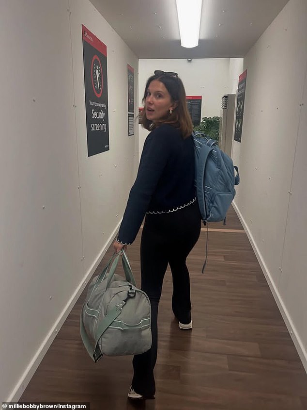 This shot showed her heading to a security screening with her bags