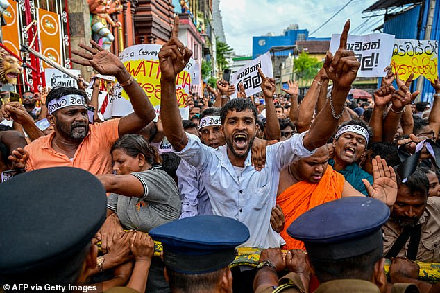 The woman has won a reprieve in her battle to claim asylum after arguing she can't be deported as she is too depressed to fly (Pictured: protesters in Sri Lanka)