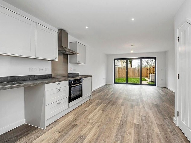 The conjoined properties are also furnished with sleek kitchens (pictured) and garden space