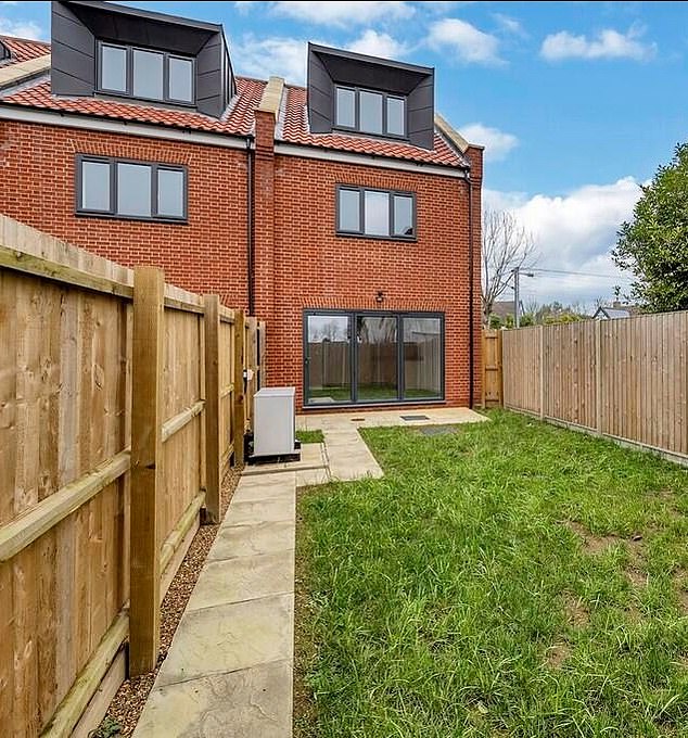 According to promotional materials, the homes are 'nestled in the tranquil and sought-after village' and 'designed for modern living and comfort, providing ample space and eco-friendly amenities' (Pictured: the garden area of one of the houses)