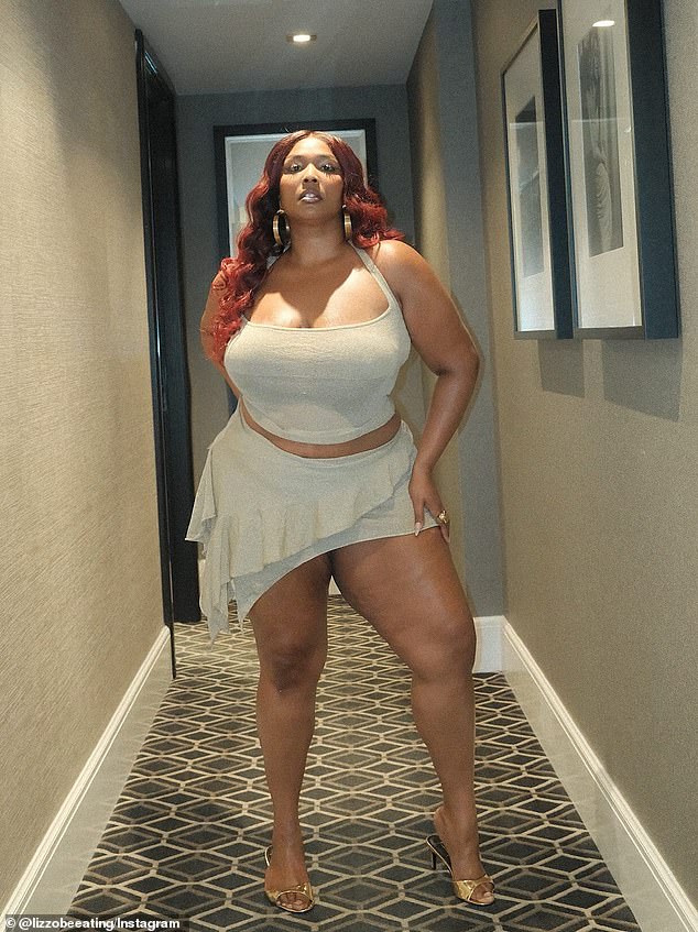 In her post, she displayed her hourglass figure while modeling a sparkly, light gray halter top paired with a matching miniskirt with a waterfall silhouette