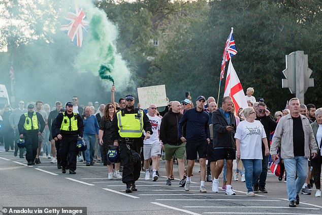 Crowds march towards the Civic Centre offices in Epping during the latest anti-migrant protest