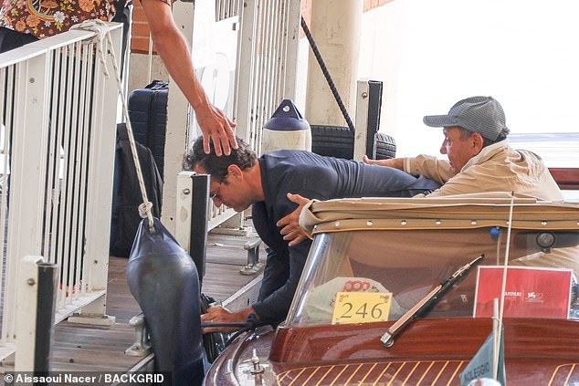 Jude was helped up by the taxi driver as he clung onto his laptop