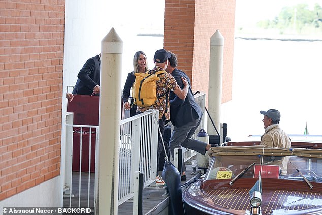 His friends and wife gave the star a helping hand off the boat