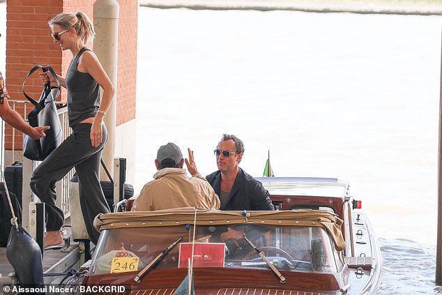 Jude's wife Philippa stepped off the boat first as they arrived at the airport