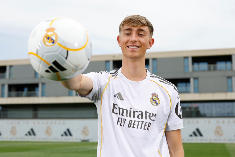 Dean Huijsen, new Real Madrid player, holding a soccer ball.