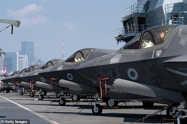 The British aircraft carrier is purpose-built to fly the new F-35 stealth jet (pictured on HMS Prince of Wales's flight deck in Tokyo)