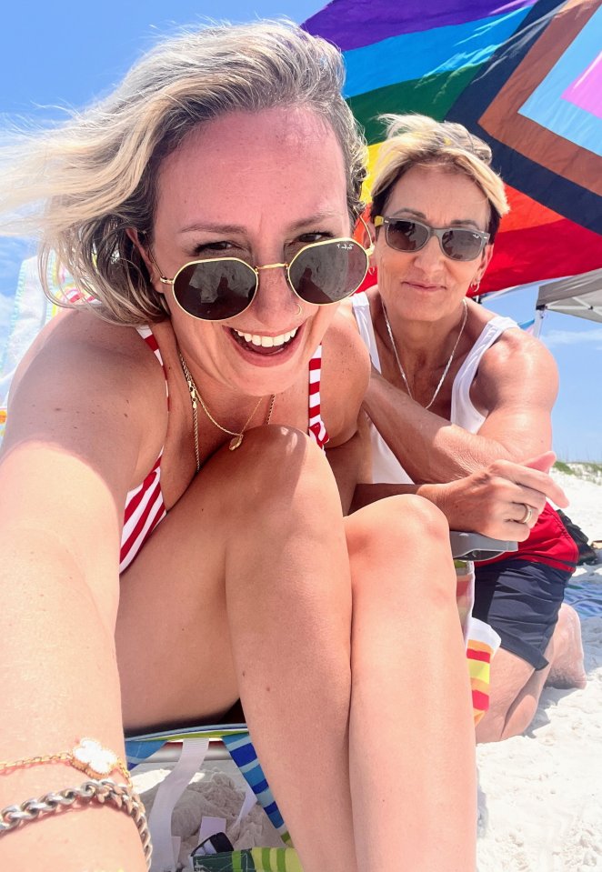 Photo of a smiling couple on a beach.