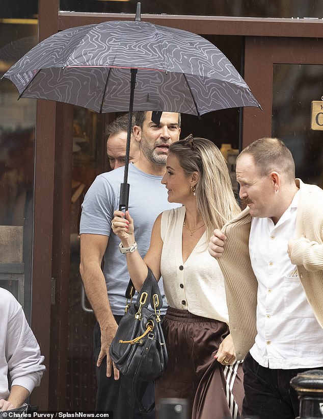 True gent Gethin, 47, gave Helen, 42, his umbrella as they headed out near to the TV studios where they film Morning Live in Manchester