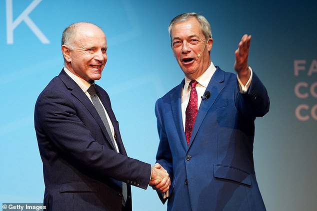 The video was shared online by conservative campaign group Turning Point UK, which counts recent Reform UK defector and ex-Tory MP Marco Longhi (pictured with Nigel Farage) as its honorary president
