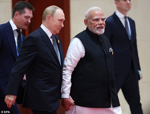 The pair beamed as they strolled in for the event