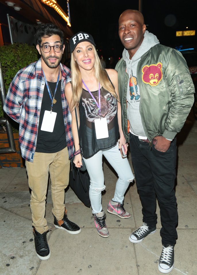 Photo of Kate Quigley and Fuquan Johnson with another man.