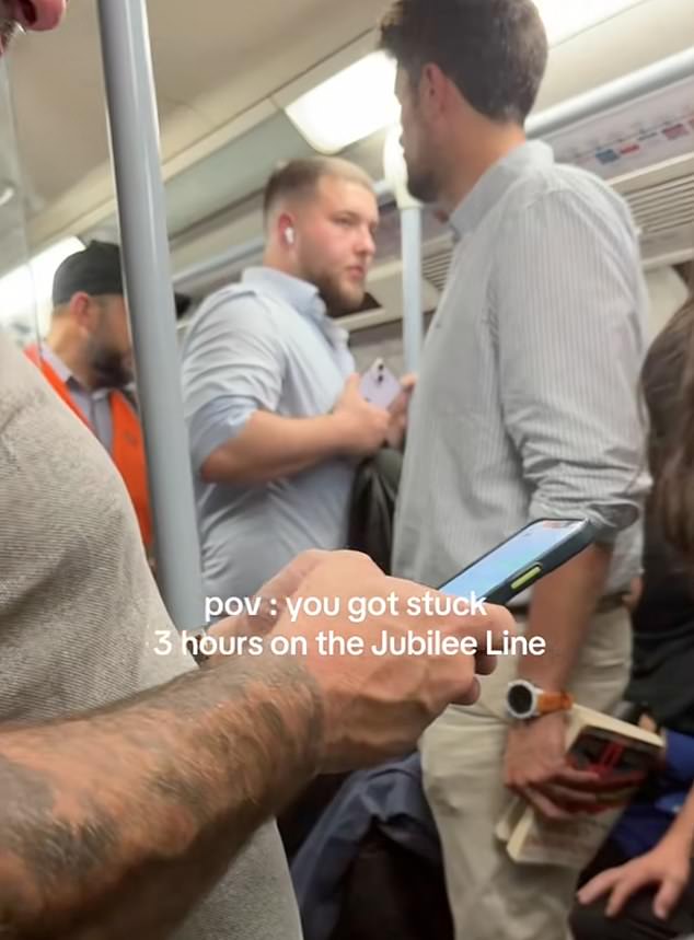 It sees Tube users squeezed together up close, with some seemingly texting people on mobile phones as the crisis ramps up