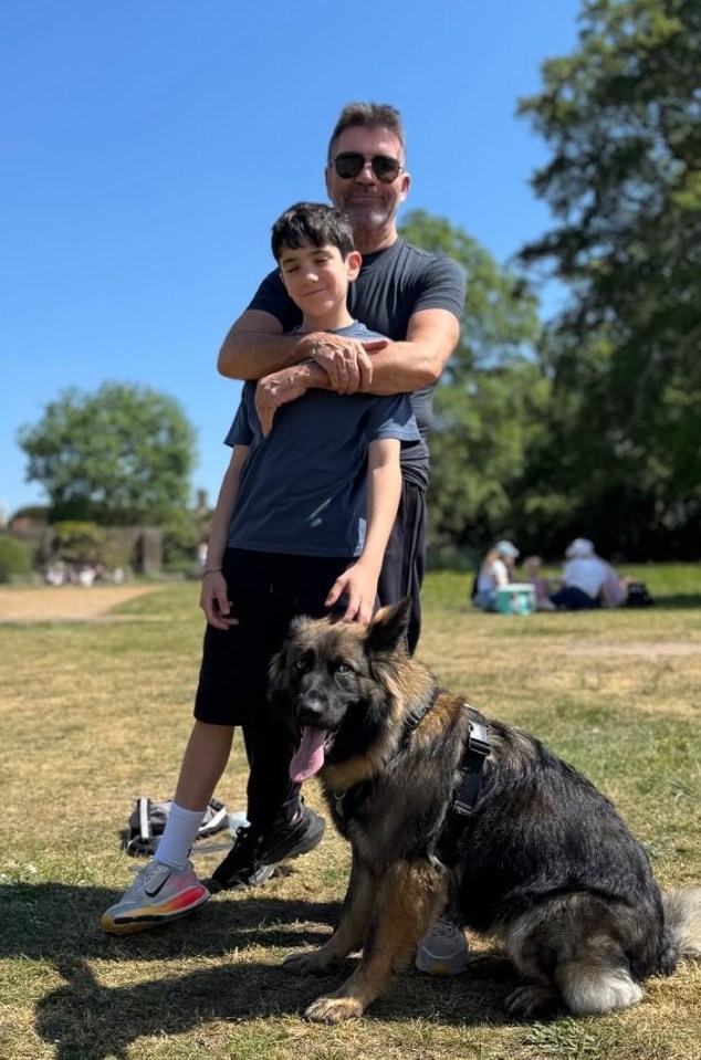 Simon Cowell with his son and dog.