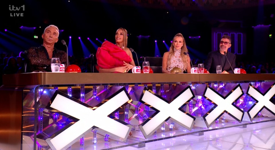 Simon Cowell and the Britain's Got Talent judges at the judges' table.